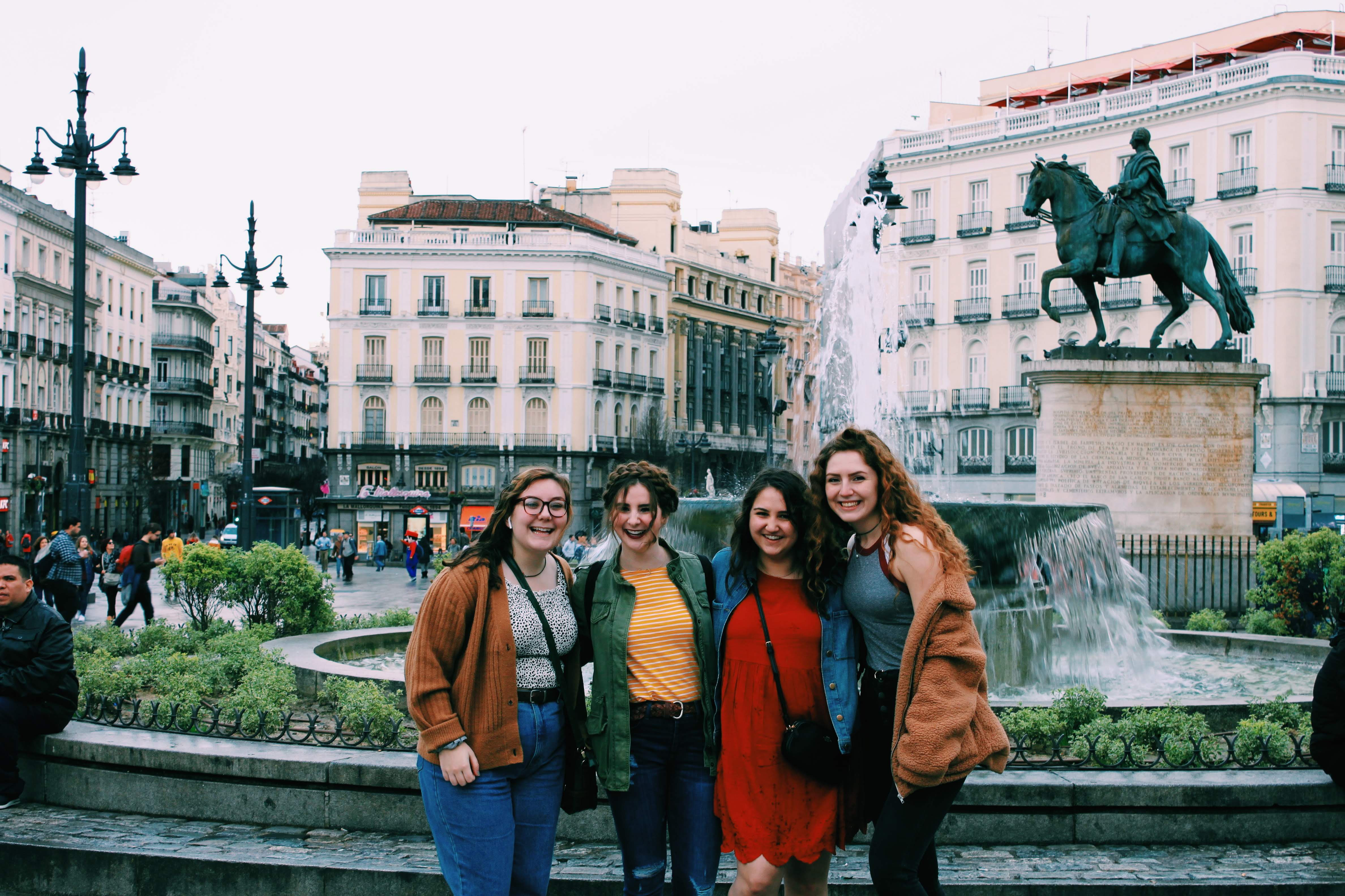 Liz and friends standing in front of Puerta de Sol in Madrid