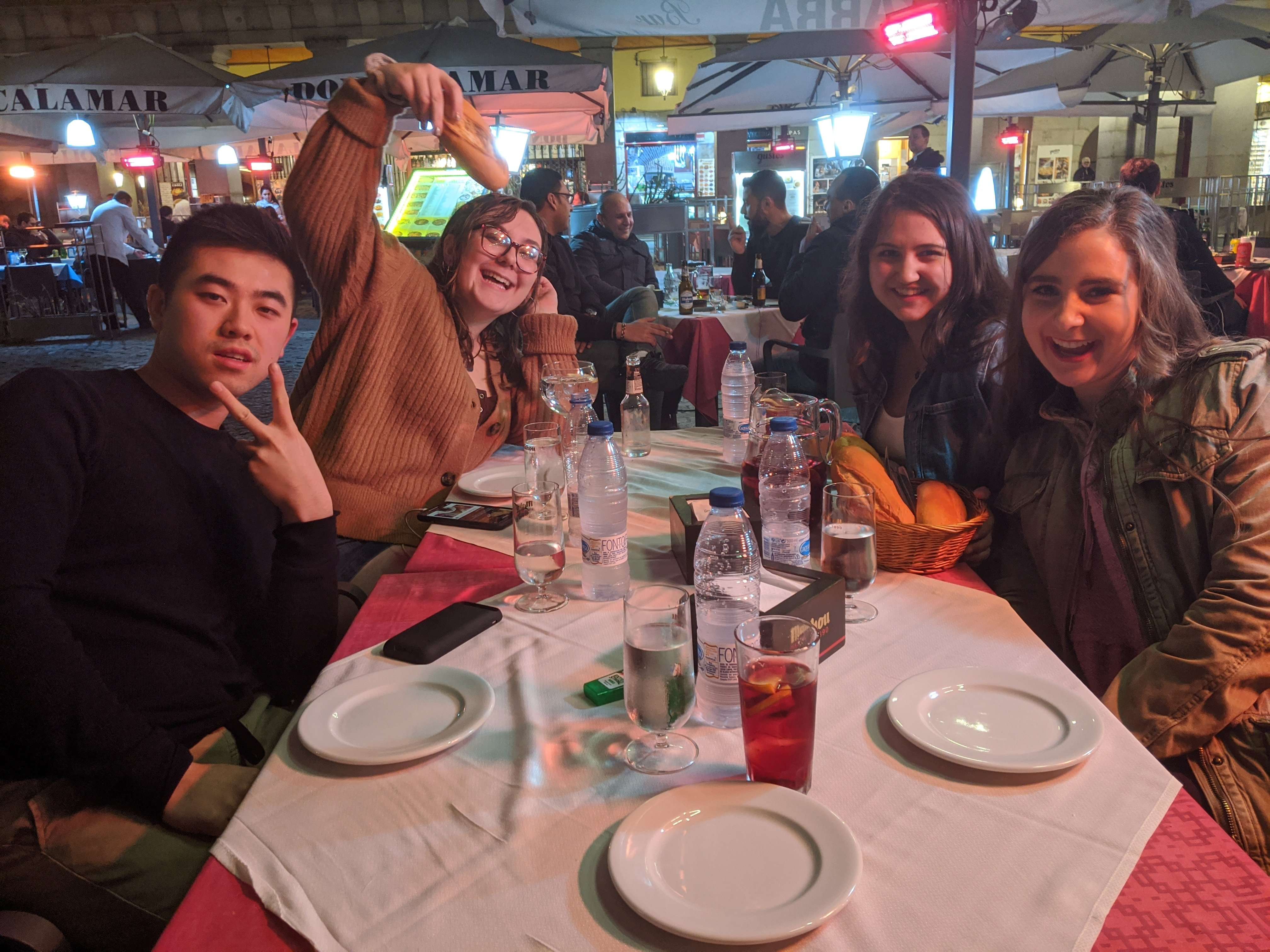 Friends sitting at a dinner place in Madrid