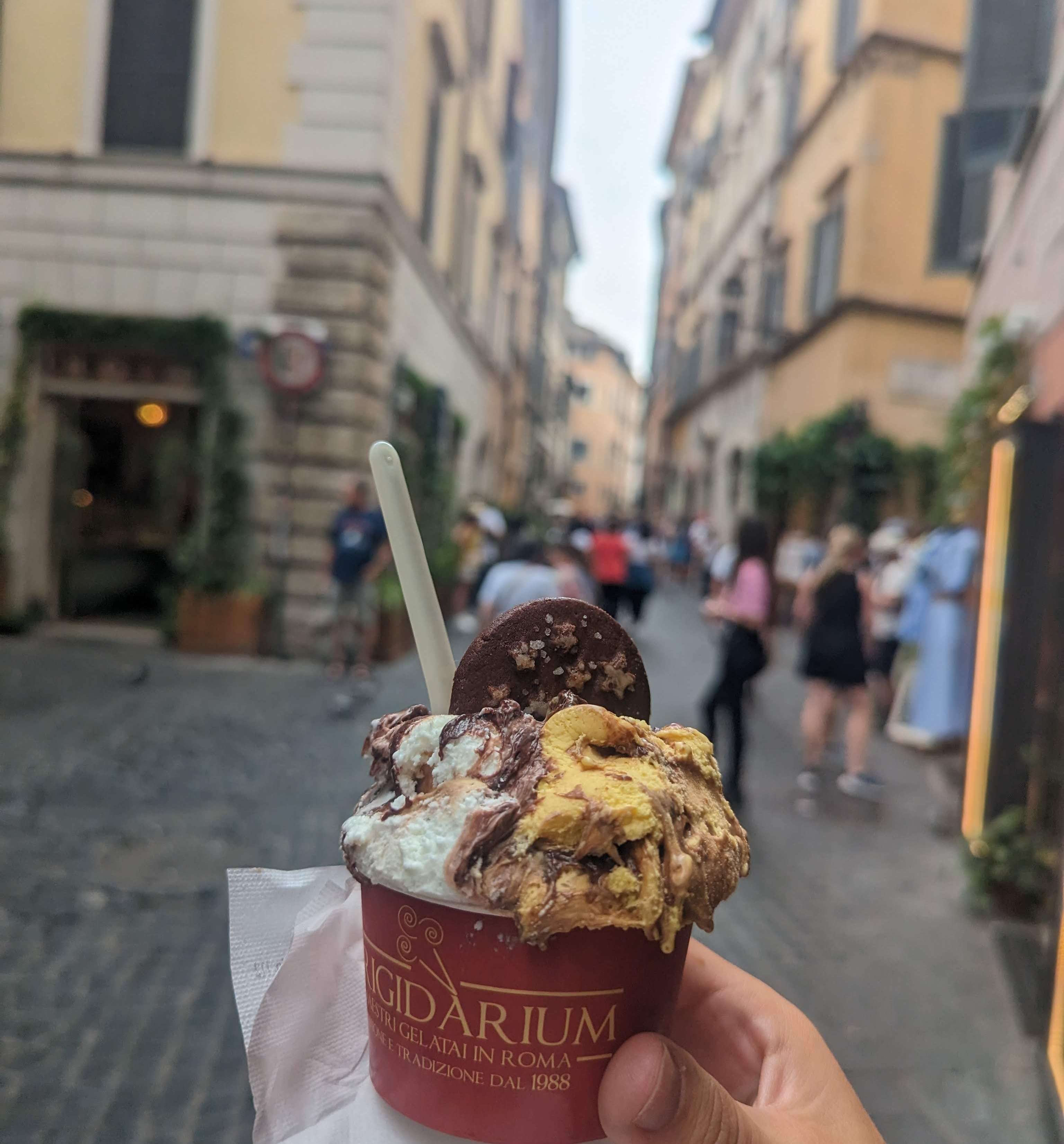 A delicious gelato in front of a popular street in Rome, Italy.