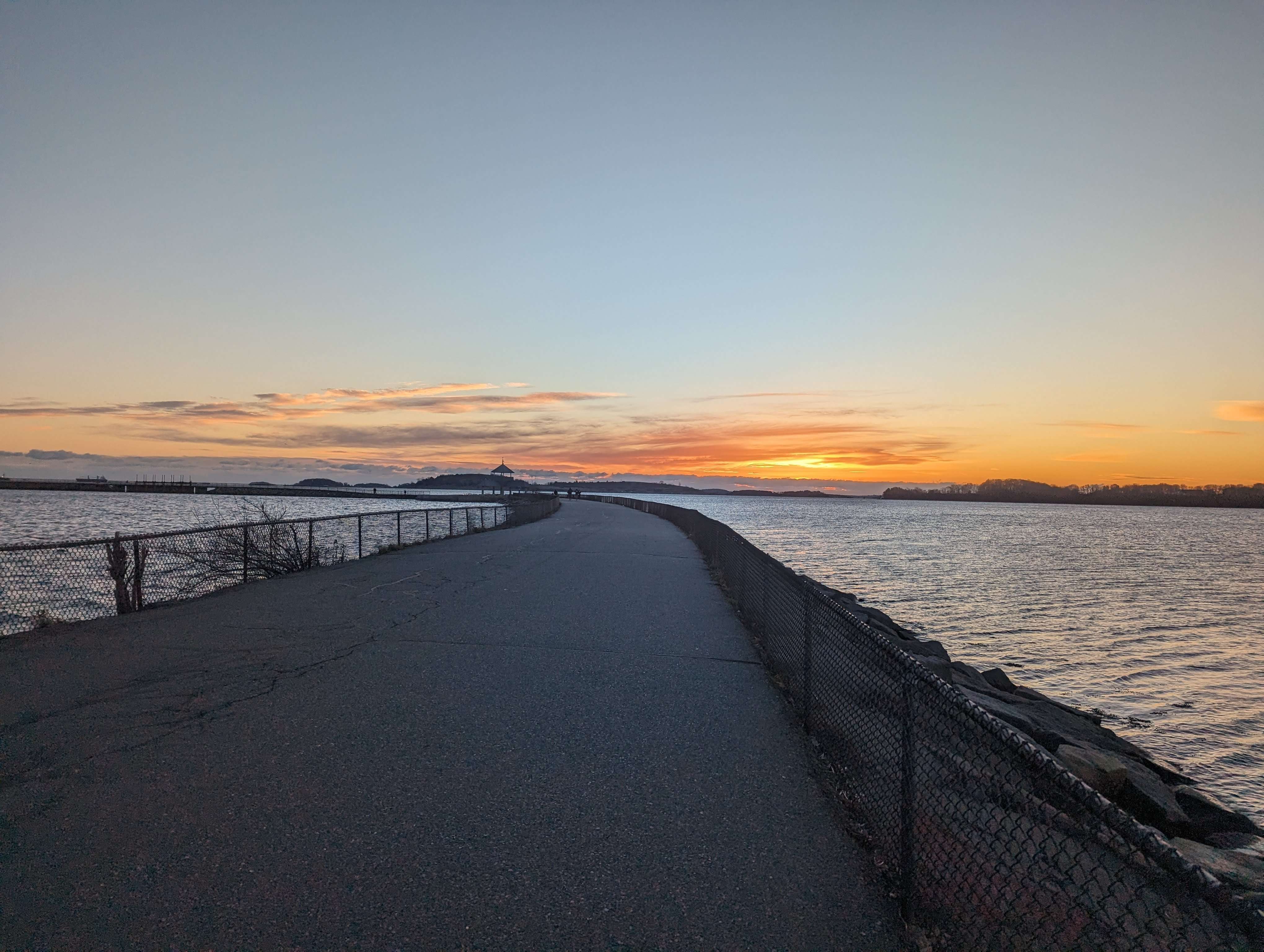 Pleasure Bay path on the ocean with a view overlooking the sunrise.
