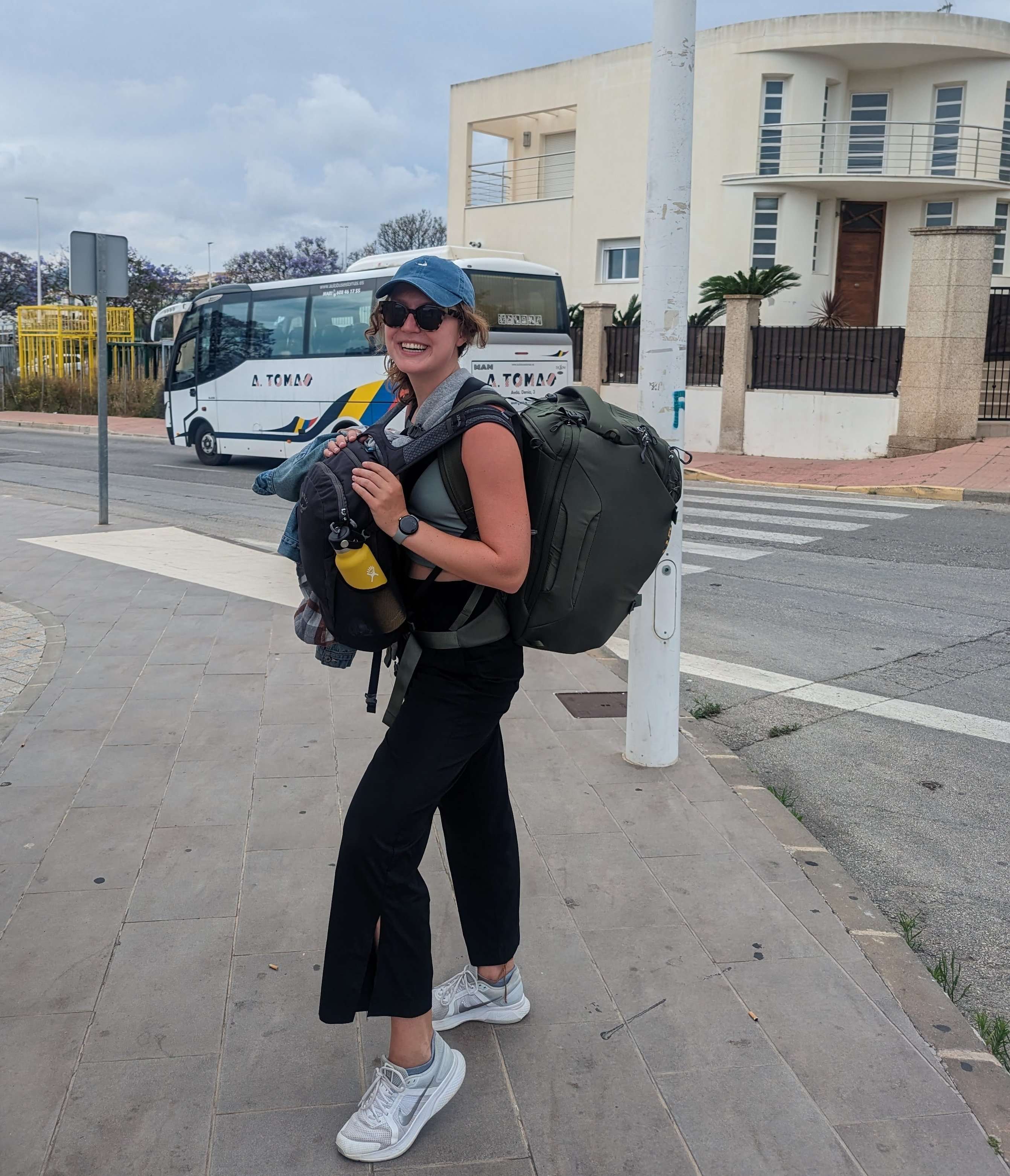 Backpack in front and back, taking up more space than I am