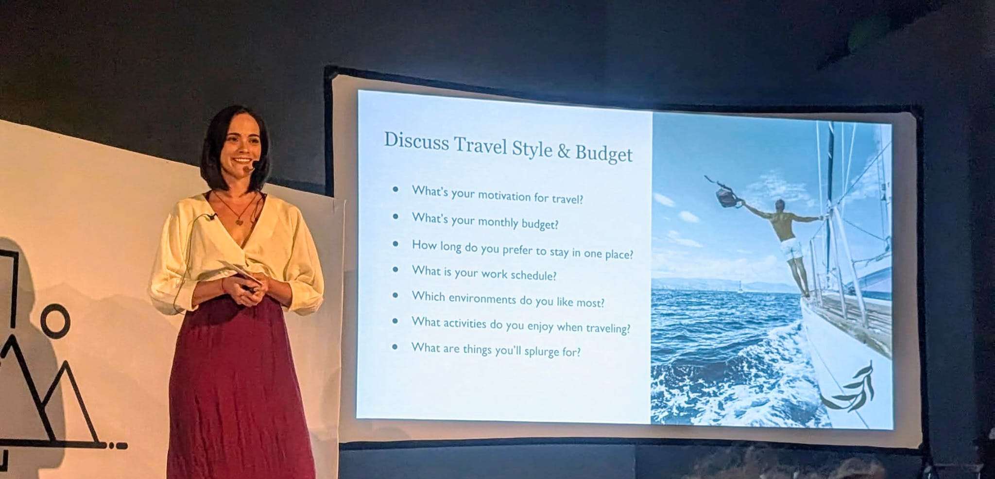A speaker at the Bansko Nomad Fest talking about determining budget and travel style.