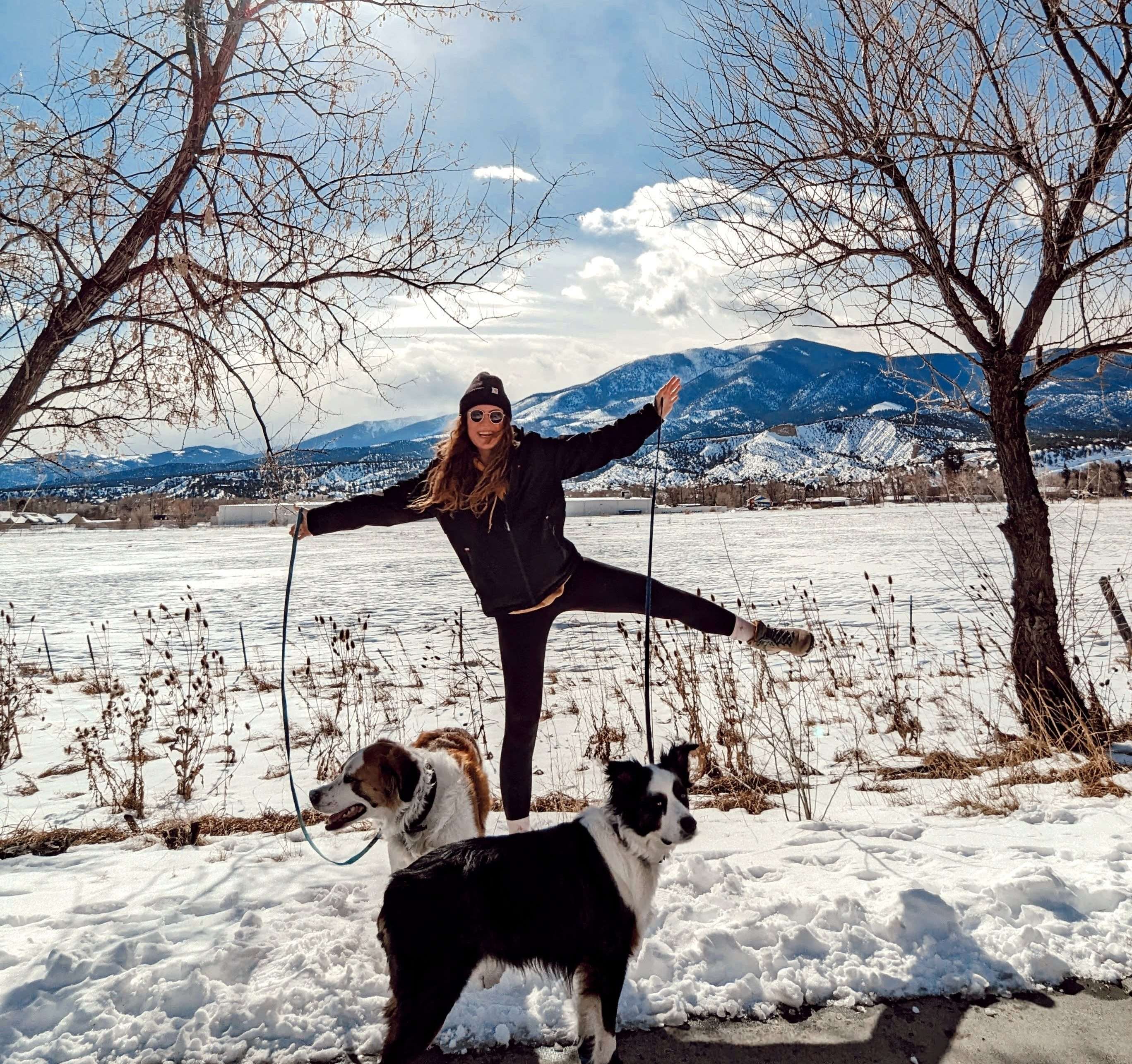 In the winter in Colorado with a mountain behind me and the 2 medium/large dogs that I am dogsitting in front of me. I am in a star shape excited!