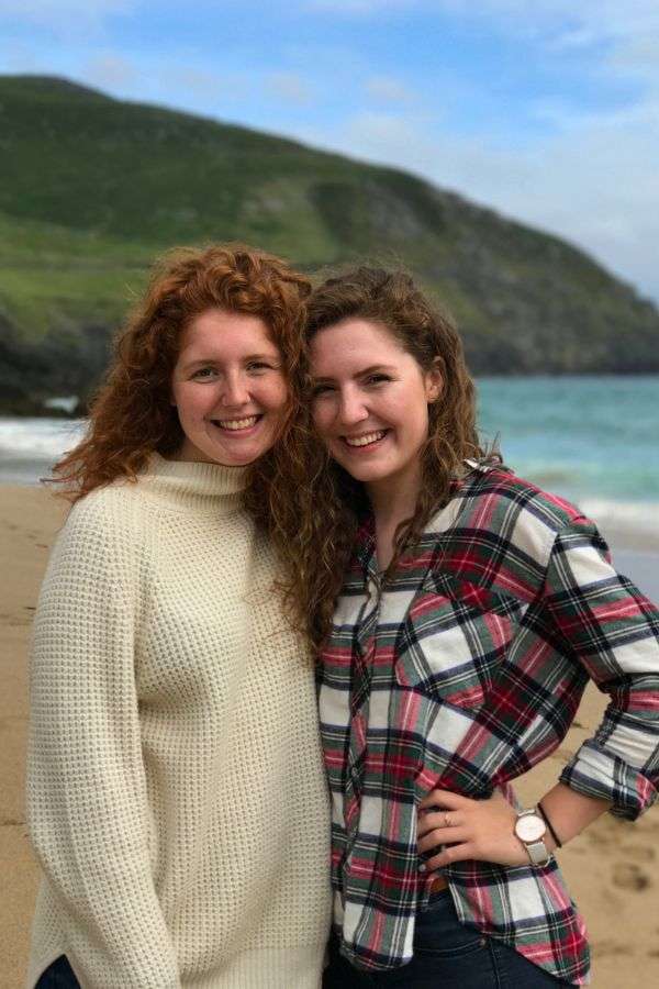 Liz and her sister standing on a beach in Ireland before getting citizenship