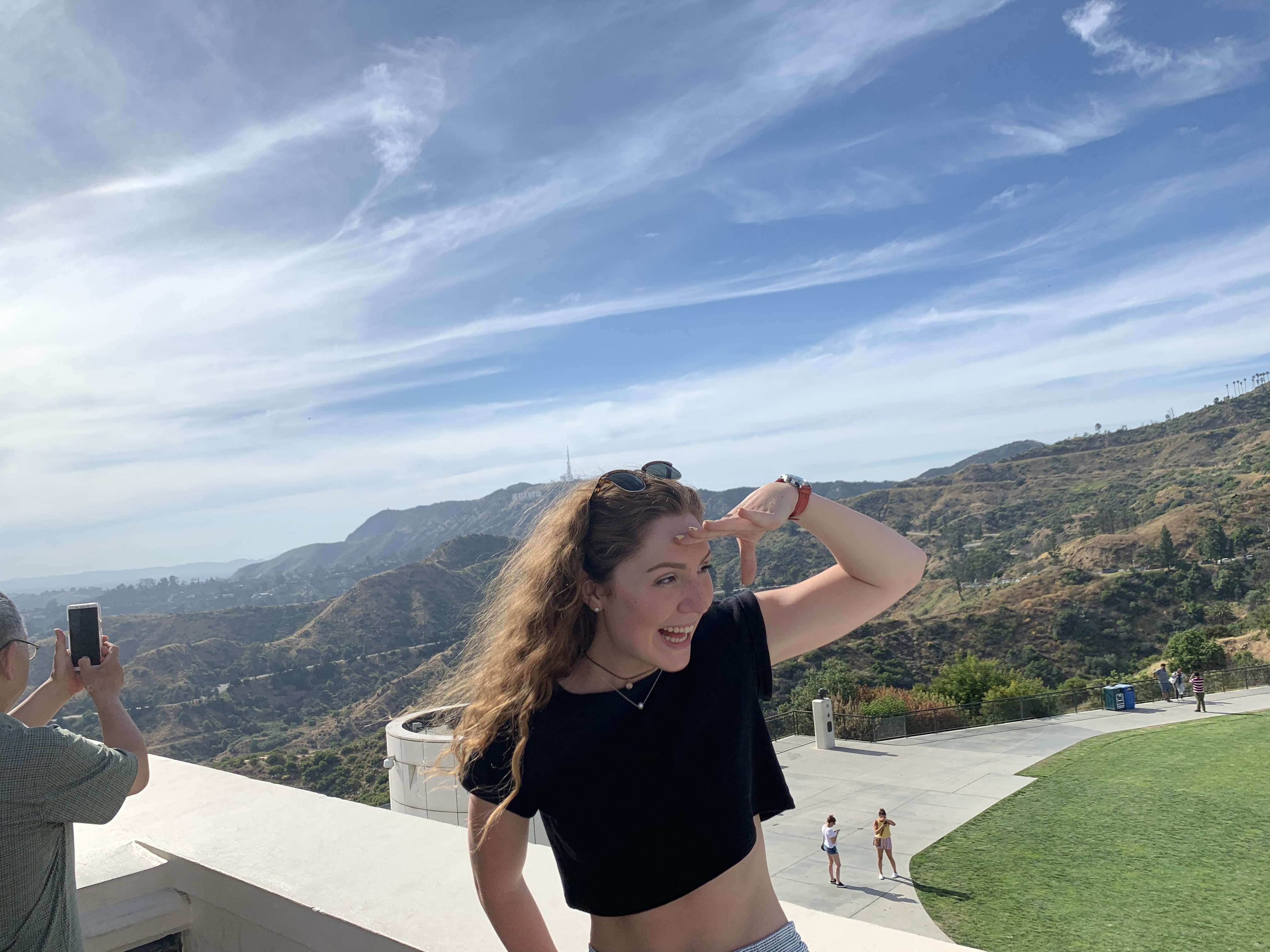 Traveler Liz looking out at the views in Los Angeles while at the Griffith Observatory.