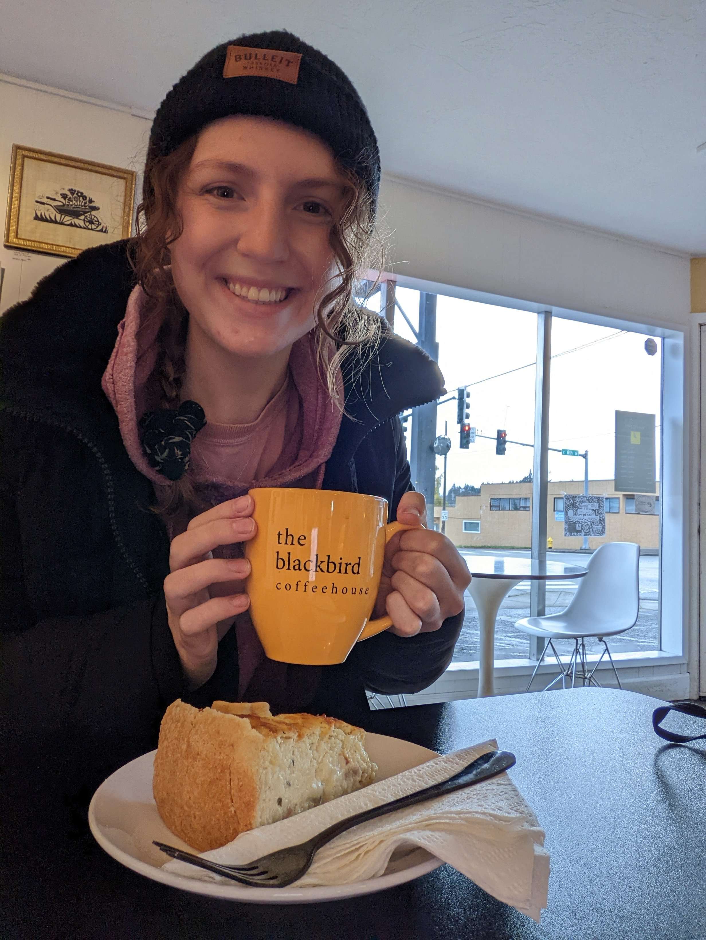 Me (Traveler Liz) holding my coffee cup at The Blackbird Coffee House in Port Angeles, Washington.