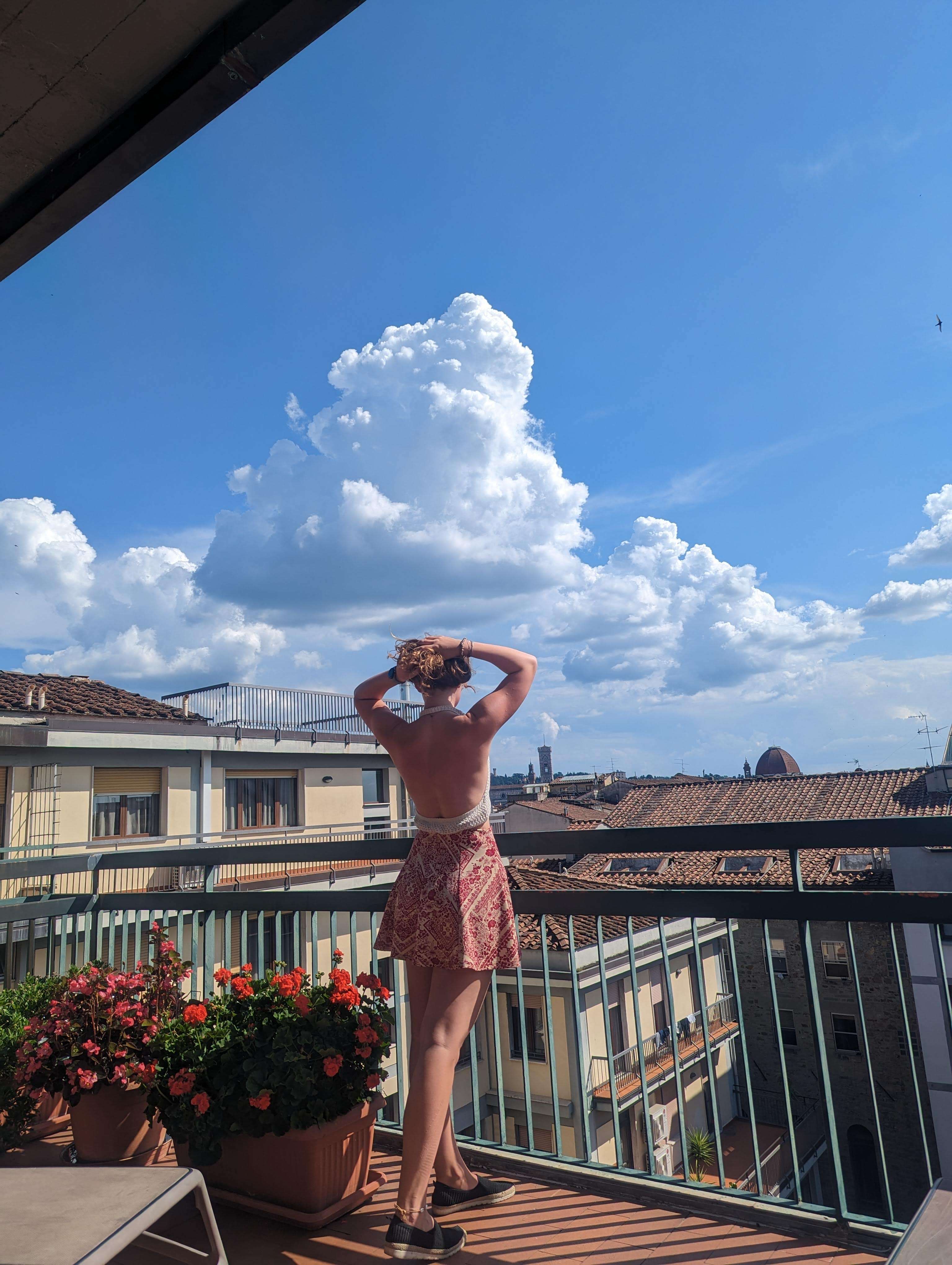 Traveler Liz pictured on a rooftop in Florence, Italy