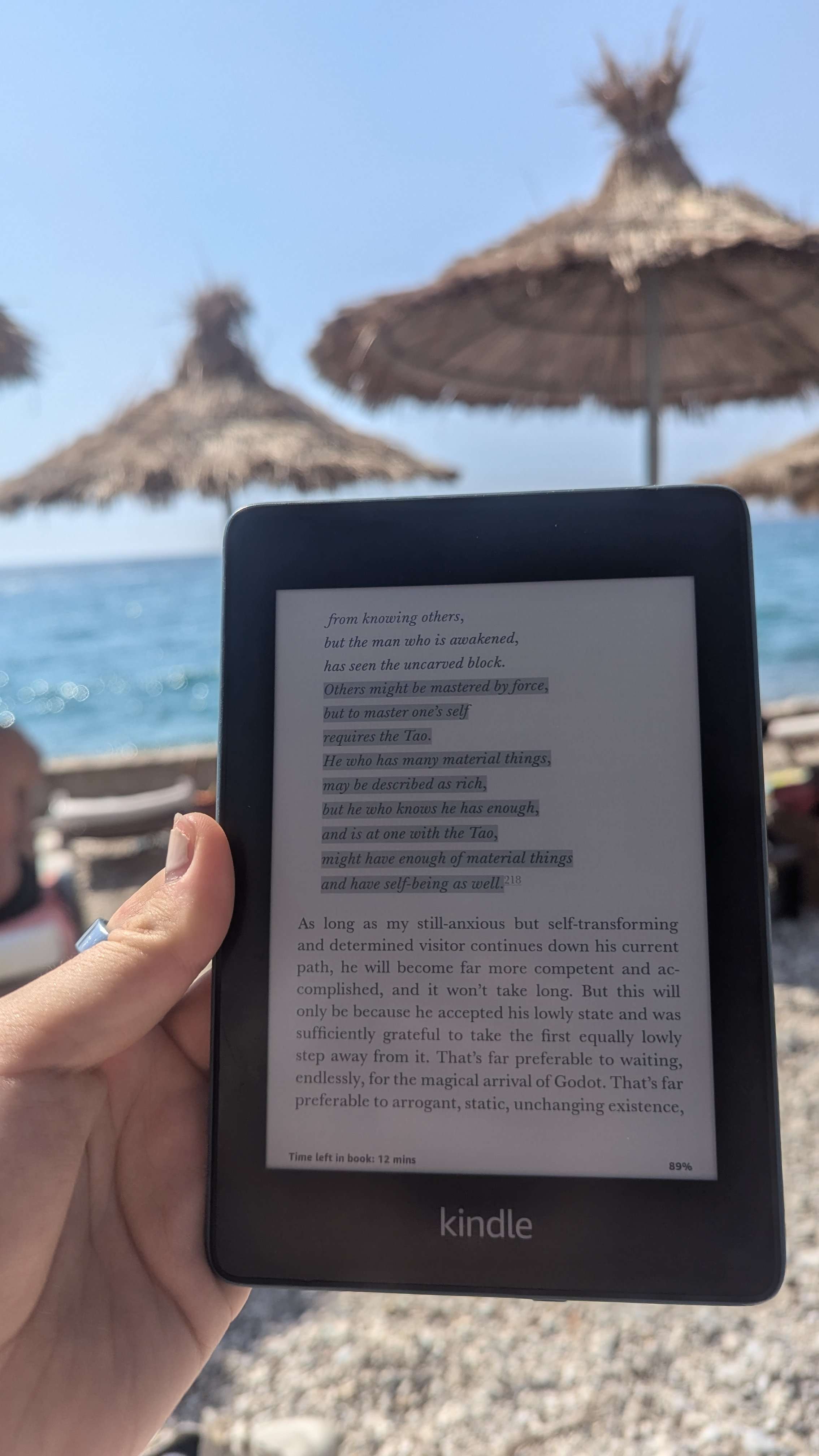 My paperwhite kindle on the beach in Greee