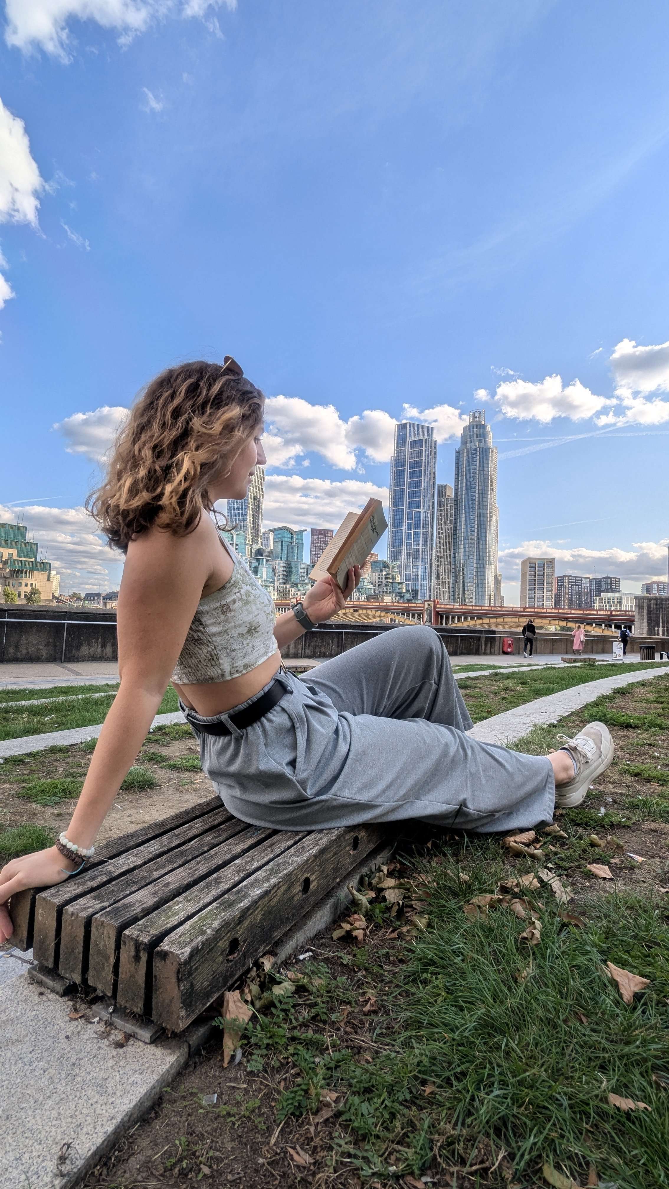 Me (Traveler Liz) reading in front of the London skyline
