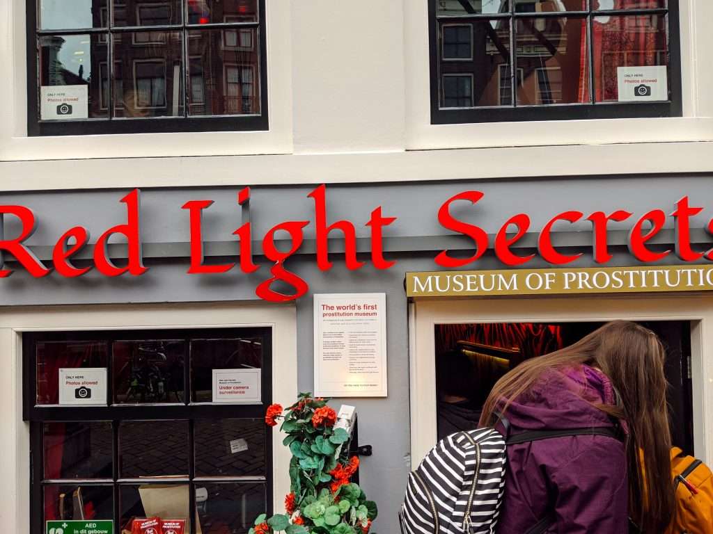 People walking into the Red Light Secrets Museum