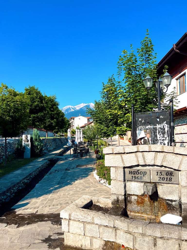 Looking up at the town wondering where to eat in bansko on the pretty street.