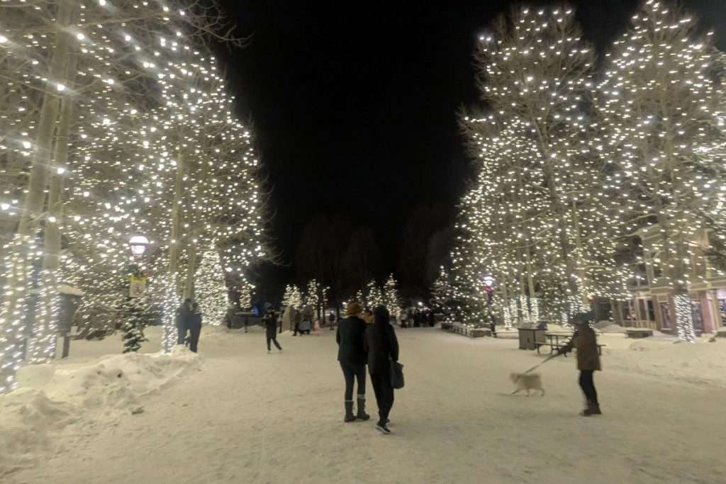A view of main street in Breckenridge with the lights on the trees