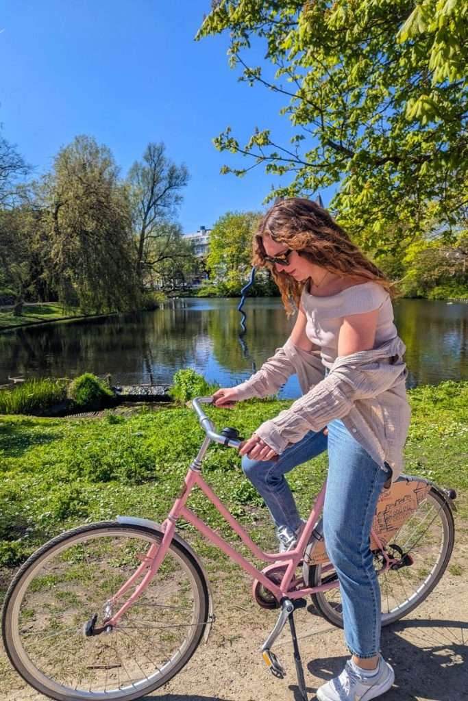 Liz sitting on a bike in Groningen in the Netherlands during a train trip.