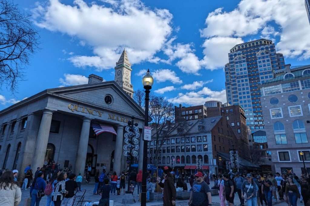 Quincy Market view with lots of people walking around on a clear day