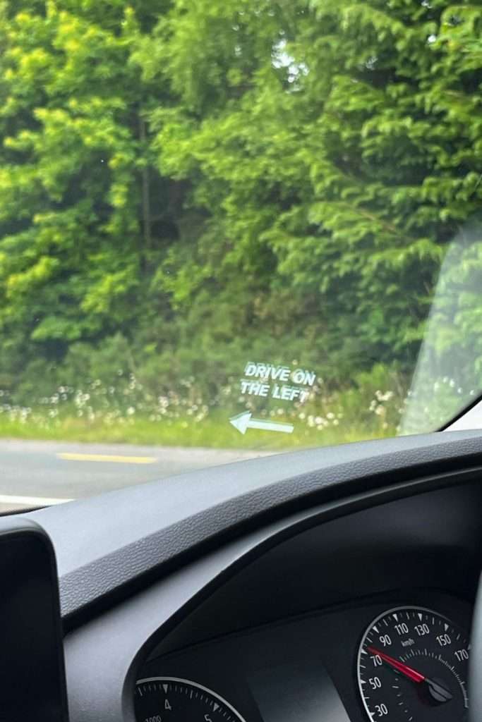 Drive on the left sign on the rental car in Ireland