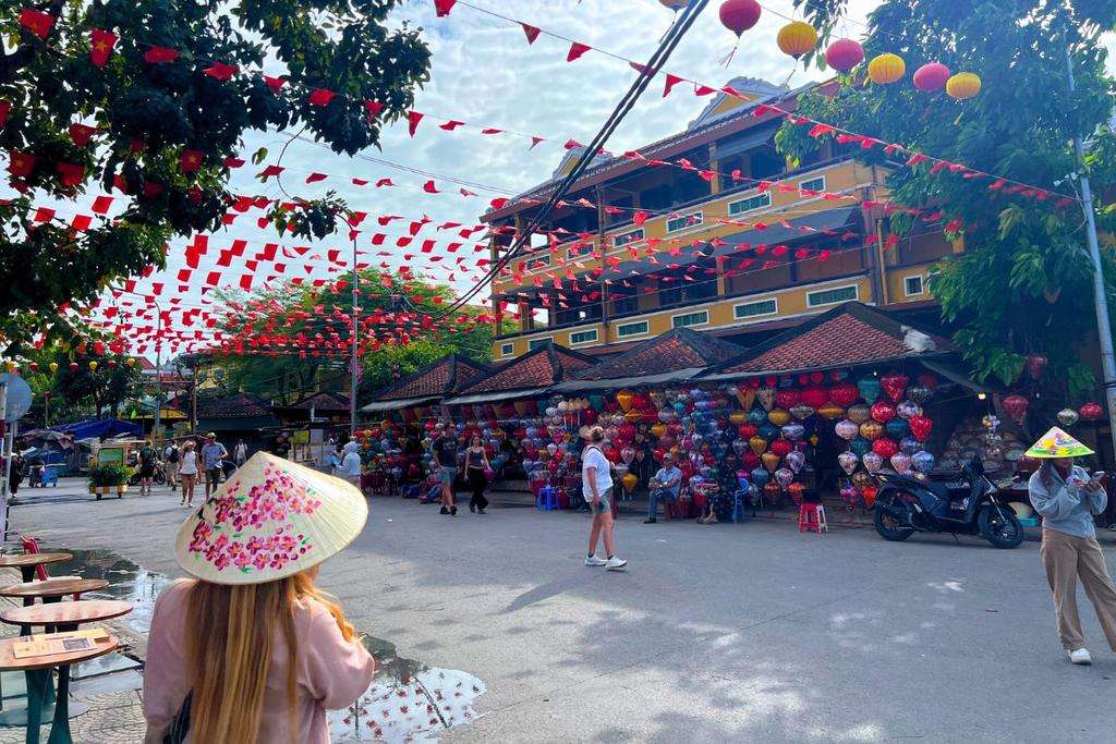 A street in Vietnam with flags, one of the trip options available with Global Work & Travel.