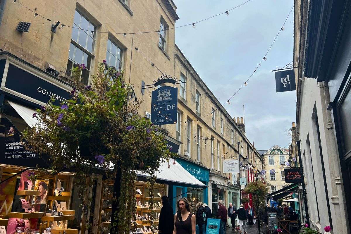 Shops and people walking around the streets in Bath, UK.
