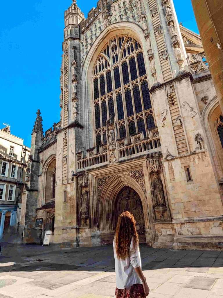 Traveler Liz looking at the Abbey in Bath.