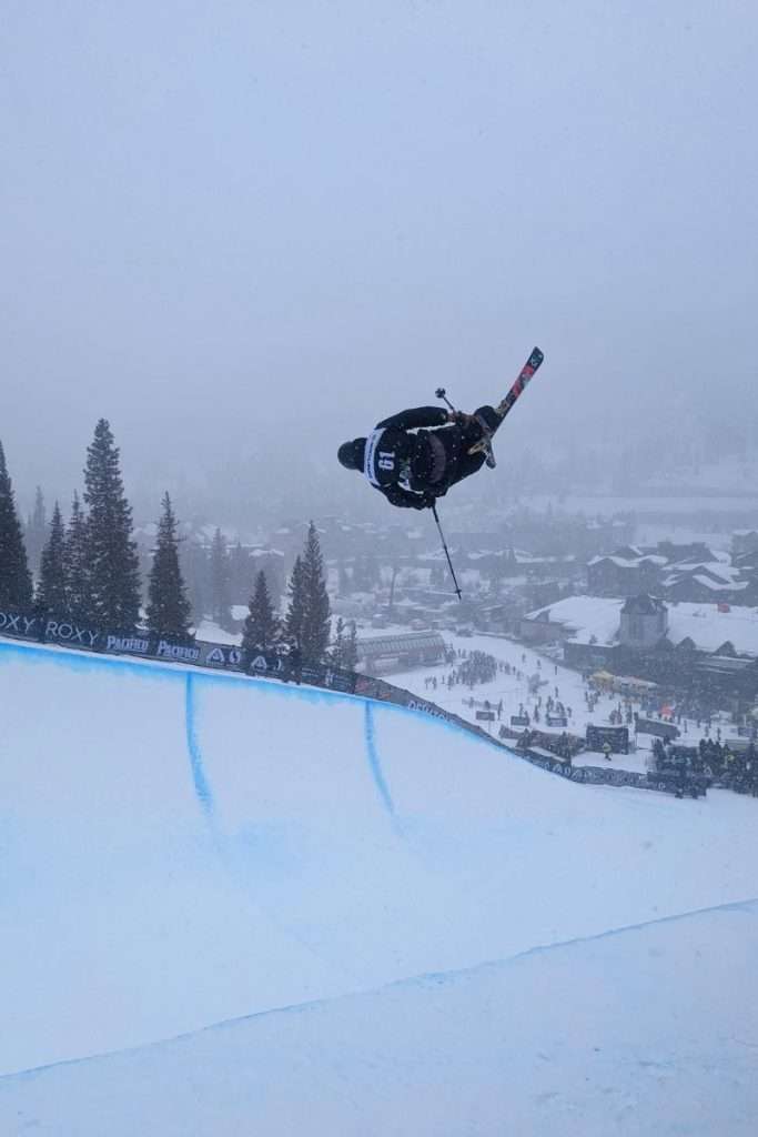 Skier doing a flip at games in Copper Mountain's ski resort in Colorado.