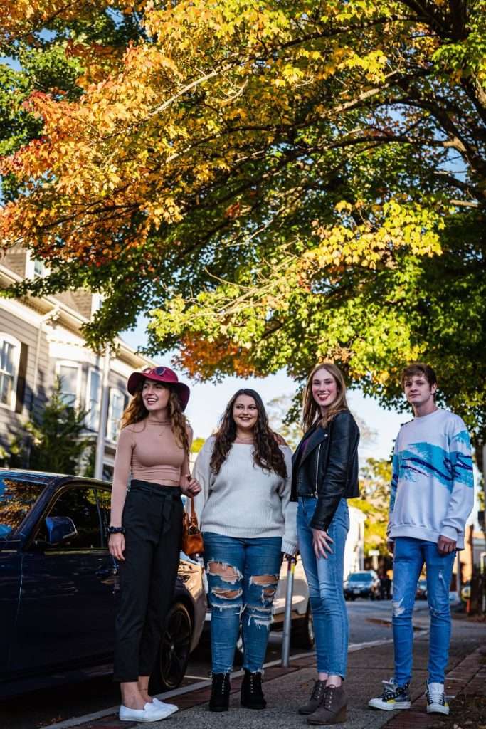 Friends walking around Salem, MA during the fall.