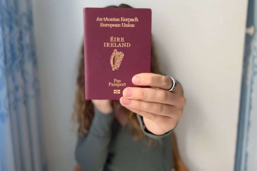 Liz holding up her Irish passport.