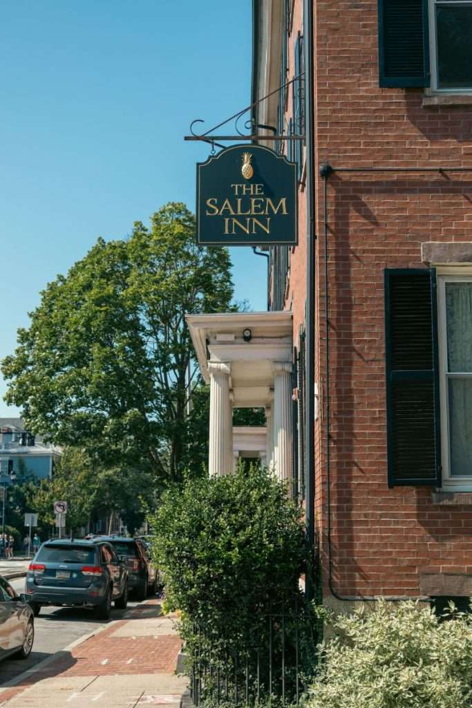 The Salem Inn sign from walking down the street in Salem Massachusetts.