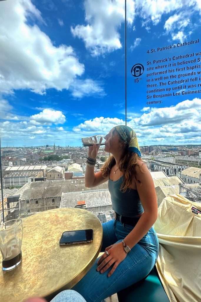 Liz drinking Guinness at the Gravity Bar at the top of the Guinness Storehouse in Ireland.